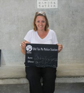 Hong Kong Police Station in Tai Po, now a small museum, woman holding a board in cell.