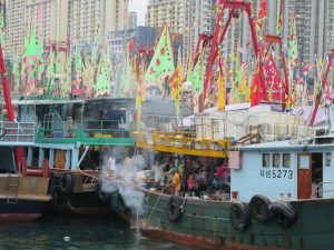 Fishing community celebration on board boats with pretty flags, Aberdeen Hong Kong.