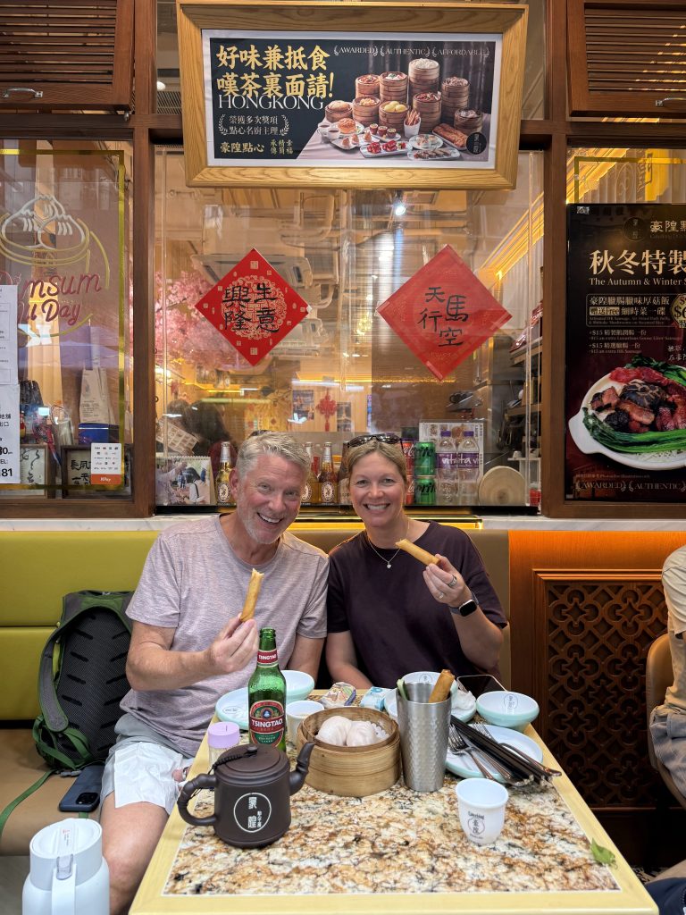 Cruise guests enjoying dim sum and spring rolls at a Hong Kong restaurant