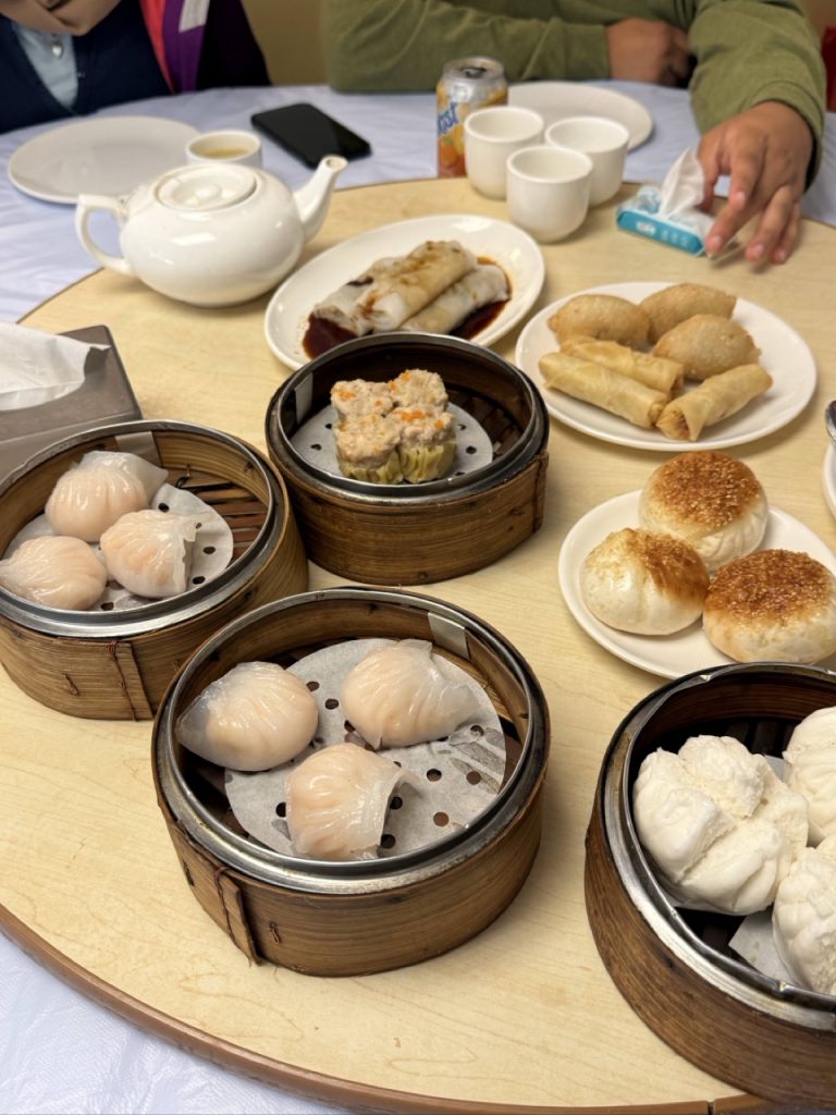 Traditional Hong Kong dim sum with har gow and siu mai served in bamboo steamers