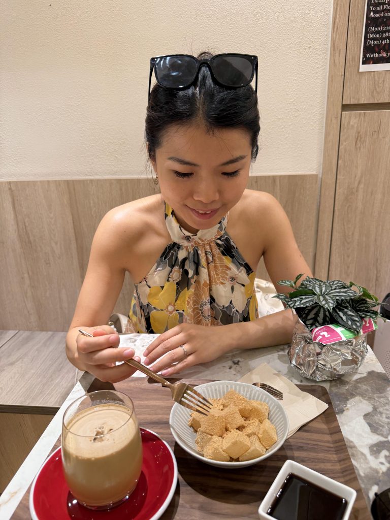 Visitor trying a traditional dessert at a Hong Kong dessert café