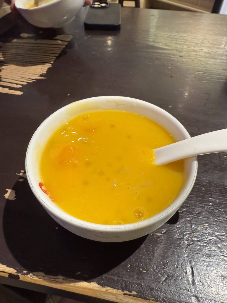 Traditional Hong Kong mango sago dessert with fresh mango and sago pearls