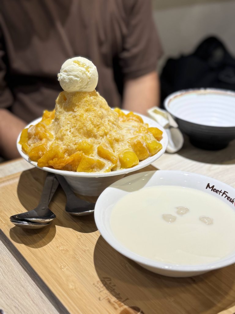 Hong Kong mango shaved ice dessert topped with fresh mango and ice cream